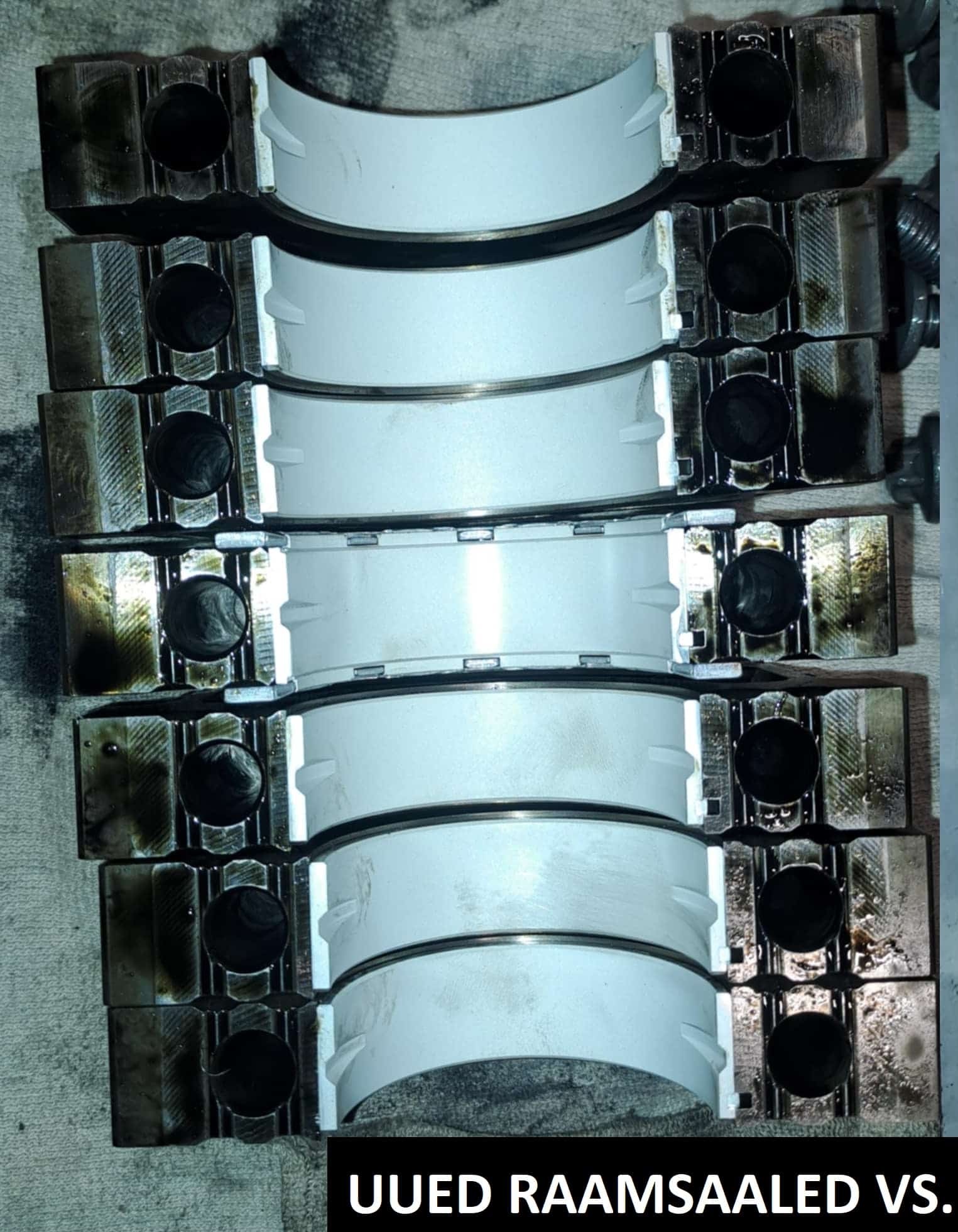 Uued ja kulunud BMW raamsaaled kõrvuti – mootori laagrite seisukorra võrdlus lähivaates.